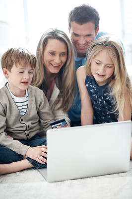 Buy stock photo Online shopping, laptop and family with credit card in lounge, happy people and purchase on website. Parents, smile and bonding with children, ecommerce and digital payment with technology in home
