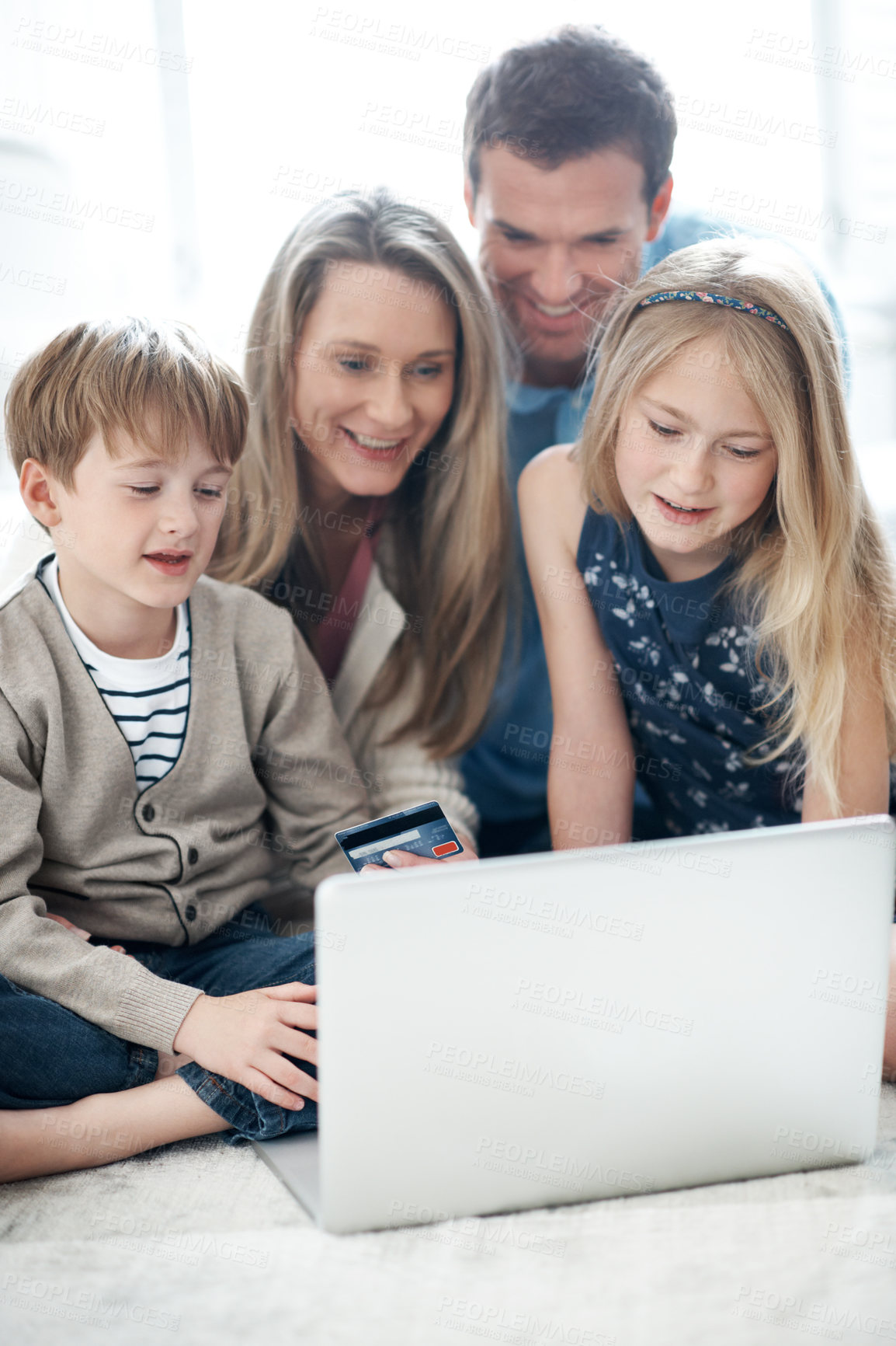 Buy stock photo Online shopping, laptop and family with credit card in lounge, happy people and purchase on website. Parents, smile and bonding with children, ecommerce and digital payment with technology in home