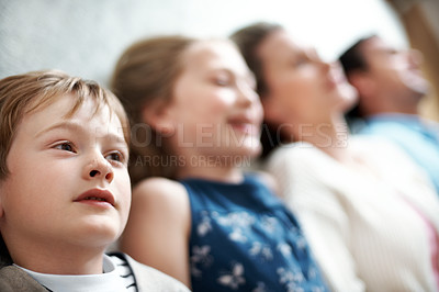Buy stock photo Thinking, child and relax on floor with family, love and parental support for bonding together. Thoughts, kid and people resting at house with reflection, comfortable and connection for weekend break