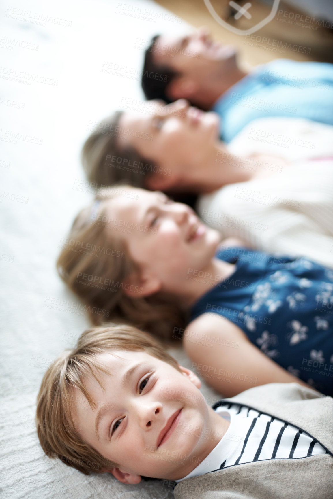 Buy stock photo Smile, family and portrait of child on floor in home for bonding, relax and break together. Happy, calm and kids with parents on carpet for connection, care and love on weekend in living room.