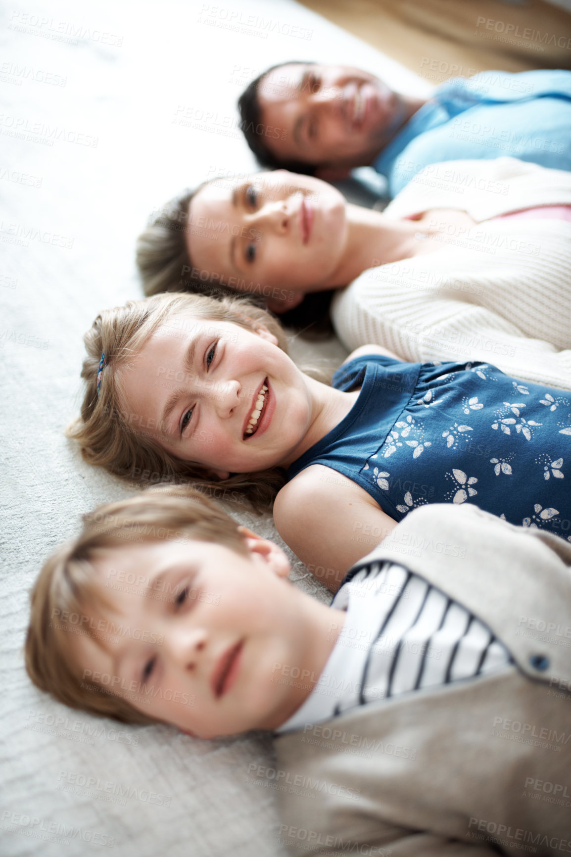 Buy stock photo Happy, relax and portrait of family on floor in home for bonding, safety and break together. Smile, calm and children with parents on carpet for connection, care and love on weekend in living room.