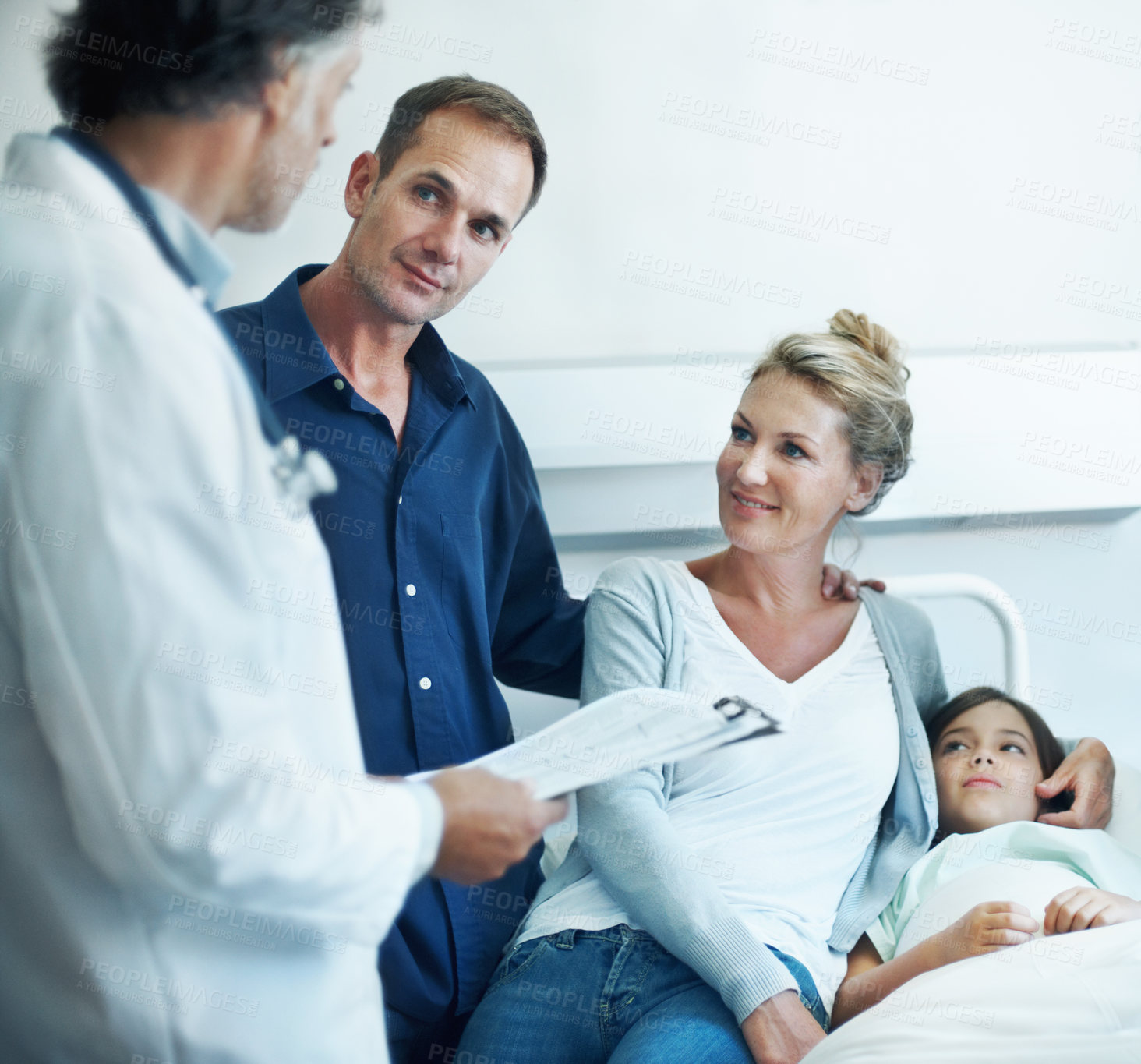 Buy stock photo Pediatrician, clipboard and child in hospital with parents, health insurance and treatment discussion. Happy people, mother and father visit in clinic with daughter, doctor and wellness checklist