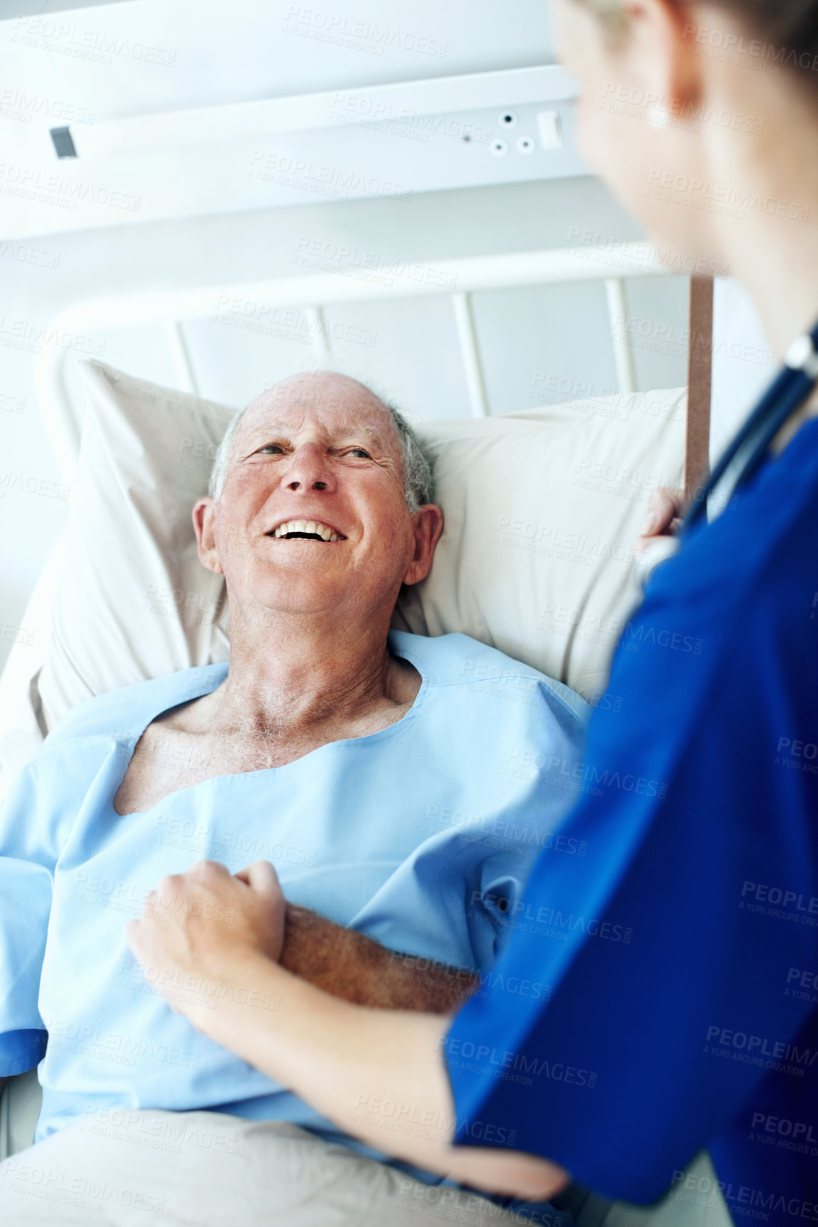 Buy stock photo Healing, nurse and comfort old man in hospital bed for wellness check, medical support or help. Health, worker and holding hands with happy senior patient in ward for recovery, good news or feedback