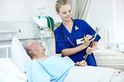 Buy stock photo Clipboard, nurse and senior man in clinic for checkup, support or rehabilitation with recovery. Writing, consultation and caregiver with elderly patient for medical help, discussion or assistance.