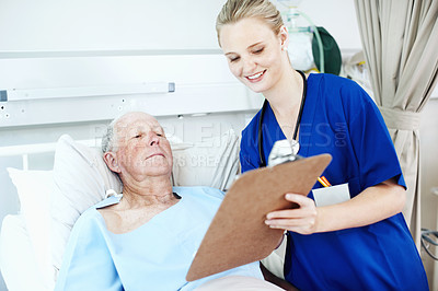 Buy stock photo Consulting, clipboard and nurse with old man in hospital bed for medical advice, recovery progress and exam. Healthcare feedback, vitals checklist and diagnosis review with senior person in clinic