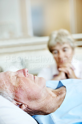 Buy stock photo Support, sleeping and senior man in hospital for recovery with empathy, love and commitment. Retirement, rest and elderly woman with patient for rehabilitation with help, care and bonding in clinic.