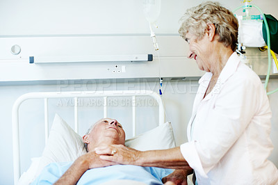 Buy stock photo Hospital bed, comfort and senior couple for support, commitment and love for surgery recovery. Happy, healthcare and elderly man and woman with compassion, affection and care for healing and wellness