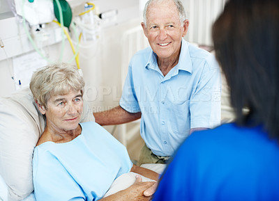 Buy stock photo Discussion, patient and nurse with old couple in hospital bed for medical advice, recovery progress and exam. Healthcare feedback, monitor vitals and diagnosis review with senior people in clinic
