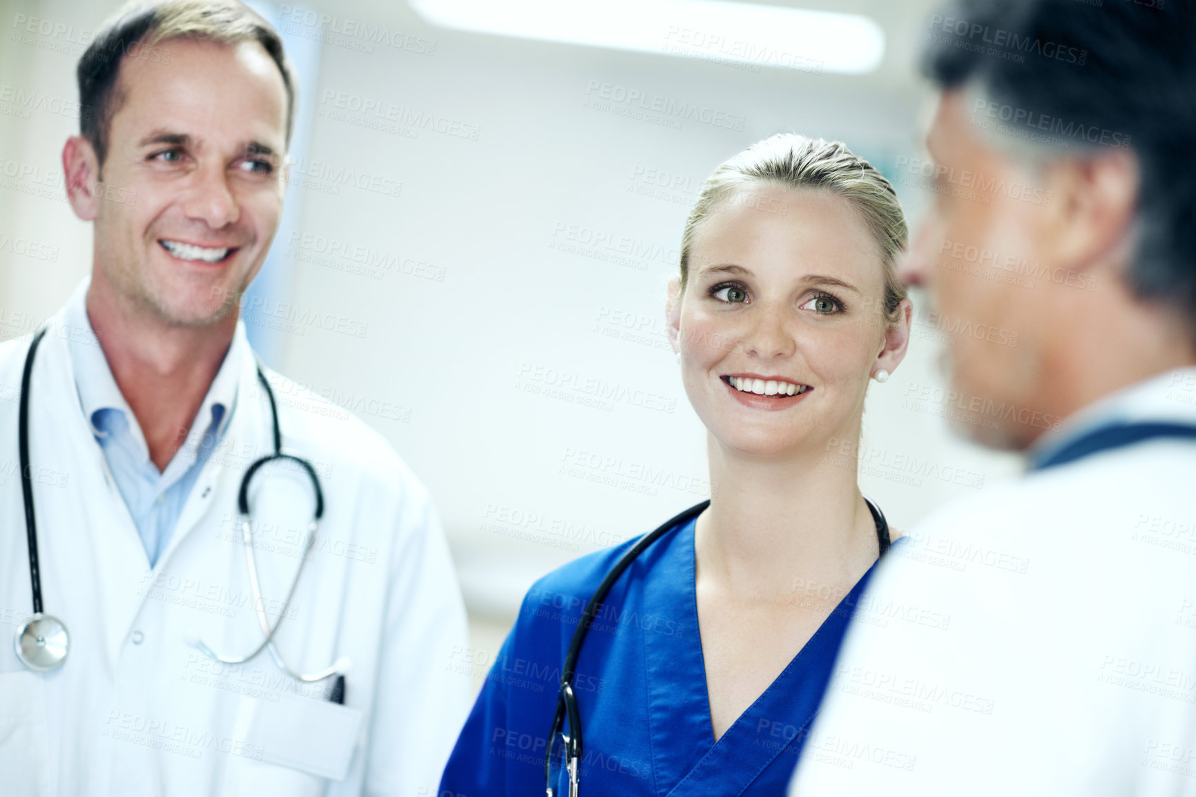 Buy stock photo Team, nurse and meeting with doctors in hospital for healthcare, solidarity and consulting. Medical, community and discussion with group of people in hallway of clinic for support and collaboration