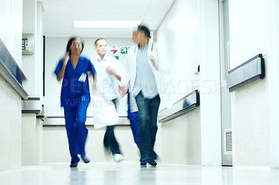 Buy stock photo Running, team and hallway with doctors in hospital for emergency, motion blur or medical crisis. Accident, healthcare rush and wellness with people in clinic for support, urgency and code blue alert