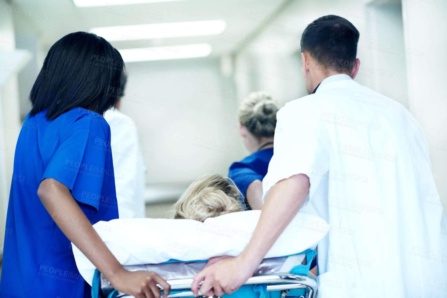 Buy stock photo Surgery, emergency and back with doctors in hospital for running, medical crisis and accident. Healthcare, injury and operation with people and patient in clinic for saving life, help and rush