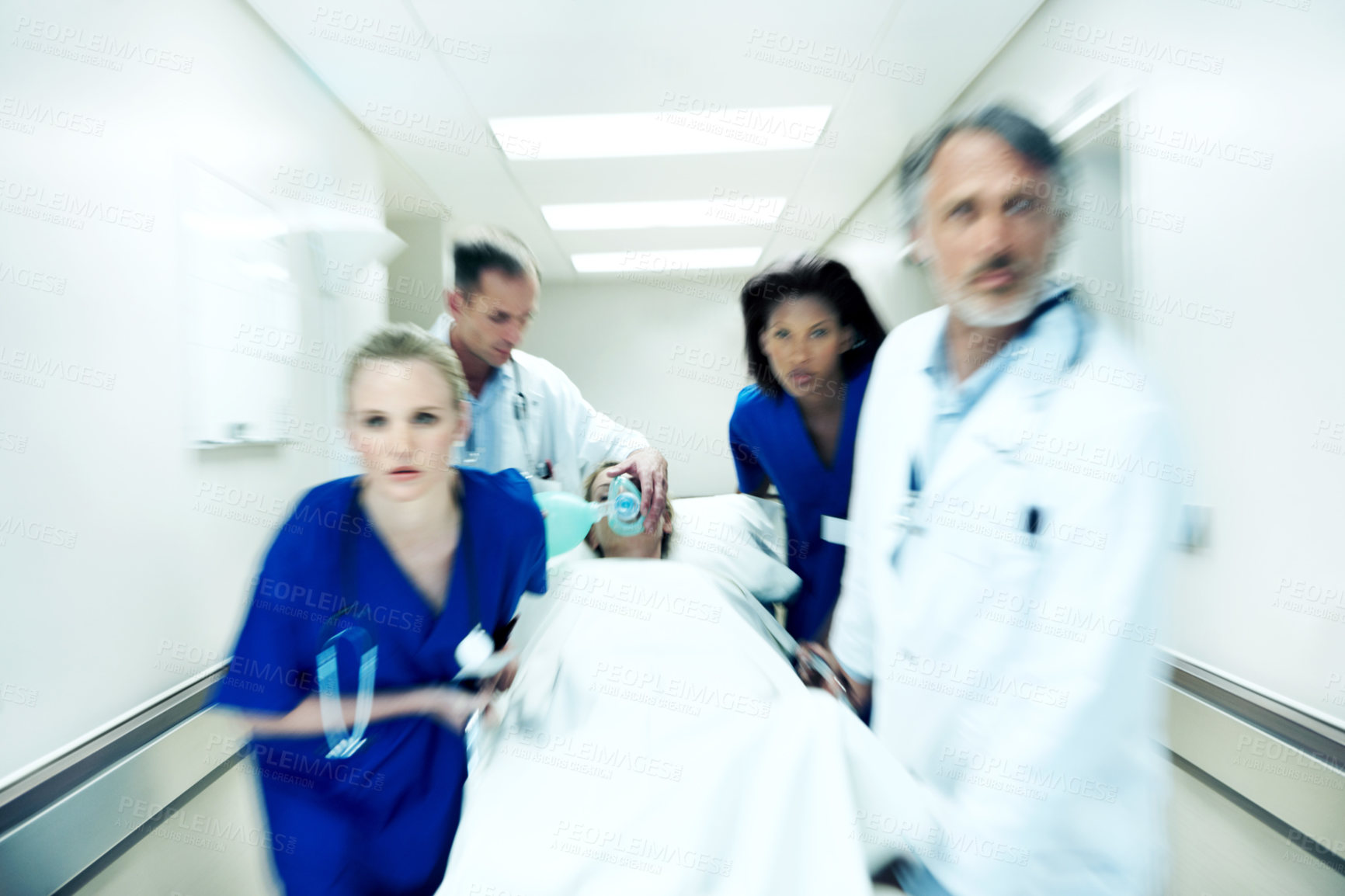 Buy stock photo Surgery, emergency and motion blur with doctors in hospital for running, medical crisis and accident. Healthcare, injury and operation with people and patient in clinic for saving life, help and rush
