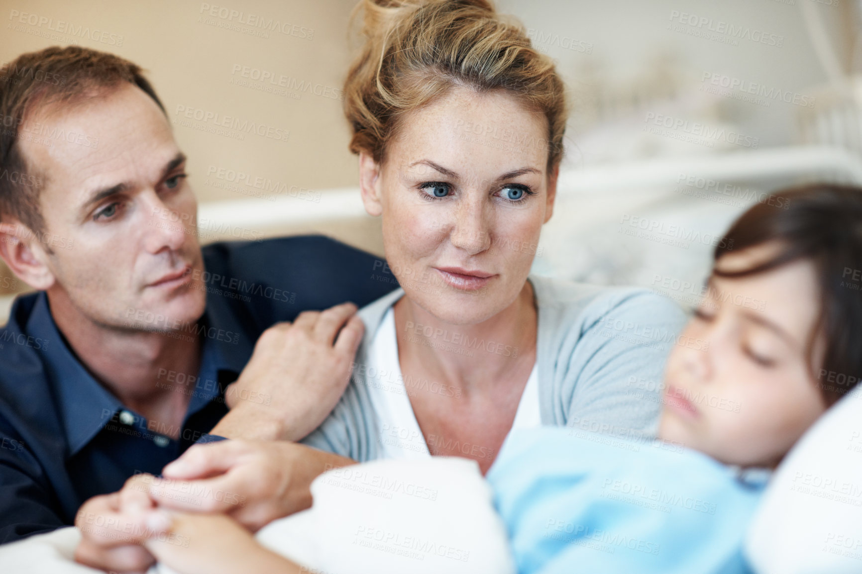 Buy stock photo Worried, parents and holding hands in hospital with sick child, support or hope for disease recovery. Mother, father and daughter sleeping in medical clinic with virus, fear and concern for healing.