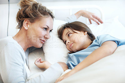 Buy stock photo Mother, support and sick child in hospital bed with love, compassion and hope for disease recovery. Family, woman and daughter in medical clinic with infection, empathy and assurance for healing.