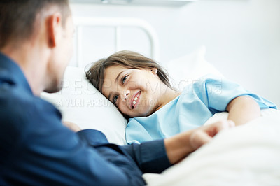 Buy stock photo Father, child and visit in hospital bed with smile, empathy and support for disease rehabilitation. Man, sick daughter and compassion in medical clinic for infection, healing and recovery process.
