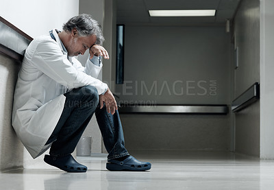 Buy stock photo Doctor, stress and thinking with man in hospital for medical fail, reflection and emergency risk. Healthcare, career burnout and perspective with mature person with depression in clinic for error