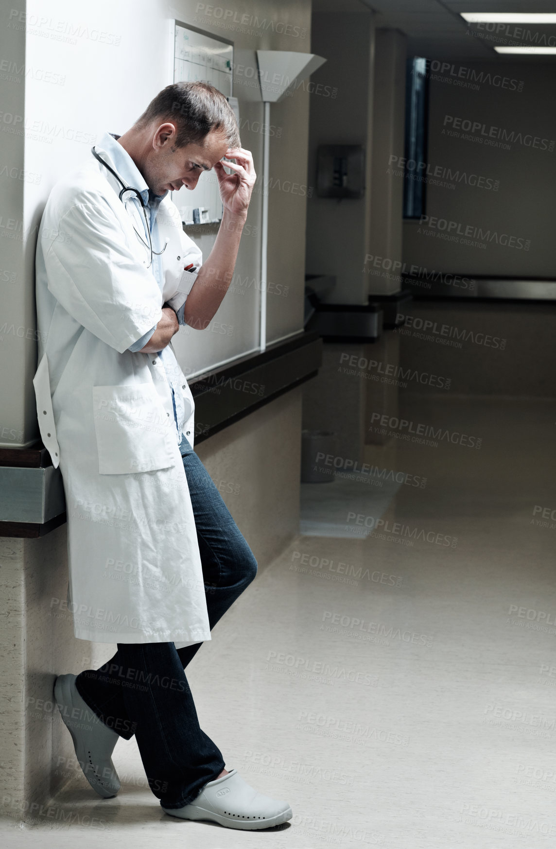 Buy stock photo Doctor, sad and worry with man in hospital for medical fail, reflection and emergency risk. Healthcare, career burnout and perspective with person with depression in hallway in clinic for error