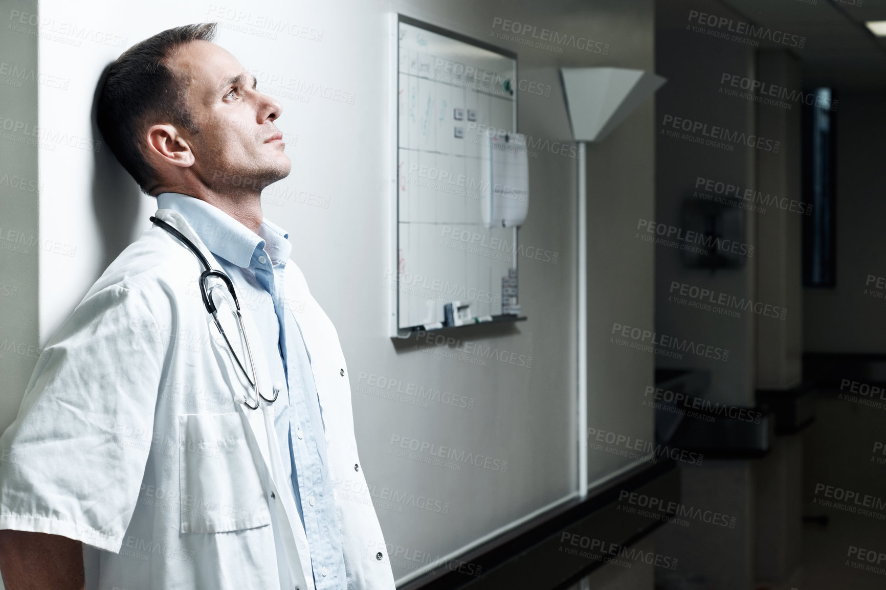 Buy stock photo Doctor, sad and thinking with man in hospital for medical fail, reflection and emergency risk. Healthcare, career burnout and perspective with person with depression in hallway in clinic for error