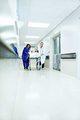 Buy stock photo Surgery, accident and corridor with people in hospital for space, medical crisis and emergency. Healthcare, injury and operation with doctor and patient in clinic for urgency, help and hallway