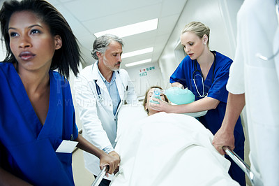 Buy stock photo Surgery, emergency and healthcare with doctors in hospital for running, medical crisis and accident. Team, injury and operation with people and patient in clinic for corridor, help and rush together