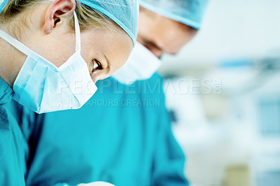 Buy stock photo Surgery, medical and team with woman in operating room for transplant emergency, help or rescue. Healthcare, accident or procedure with doctor in theater of hospital for organ graft and surgeon