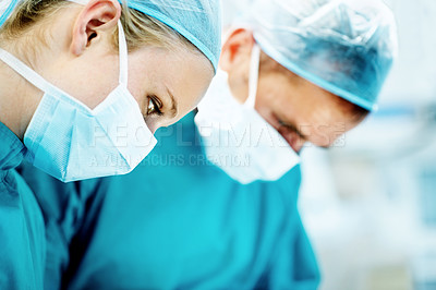 Buy stock photo Surgery, healthcare and team with woman in operating room for transplant emergency, help or rescue. Medical, accident or procedure with doctor in theater of hospital for organ graft and surgeon
