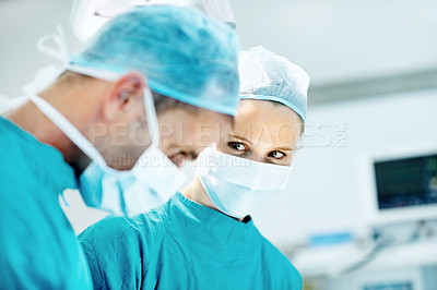 Buy stock photo Surgery, medical and face mask with people in operating room for transplant emergency, help or rescue. Healthcare, accident or procedure with doctor in theater of hospital for organ graft and surgeon