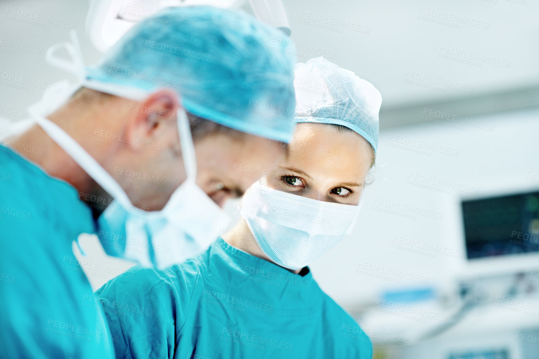 Buy stock photo Surgery, medical and face mask with people in operating room for transplant emergency, help or rescue. Healthcare, accident or procedure with doctor in theater of hospital for organ graft and surgeon