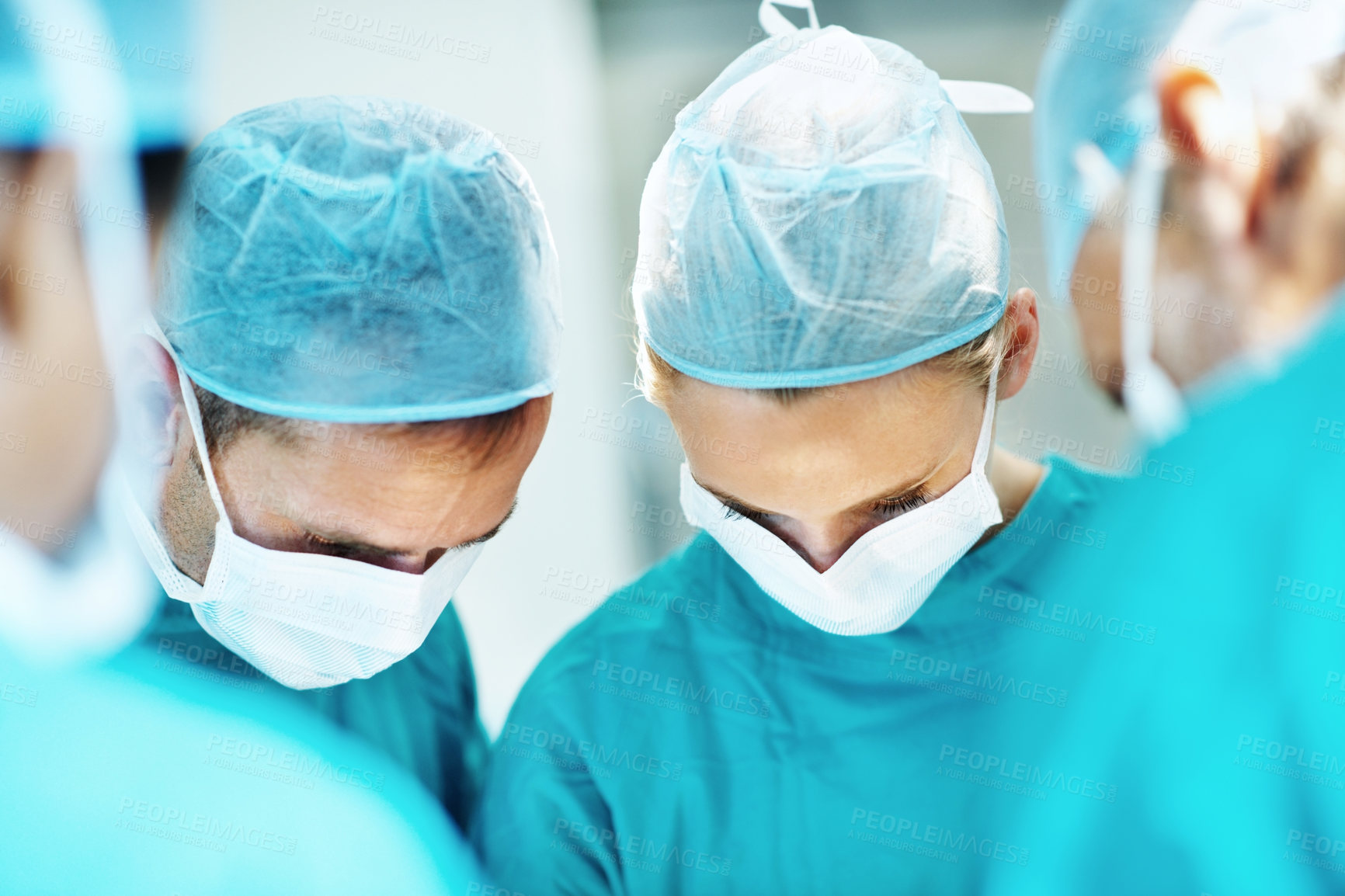 Buy stock photo Surgery, team and face mask with doctors in theater at hospital for medical operation, healing or accident. Procedure, healthcare and emergency rescue with people in operating room of clinic