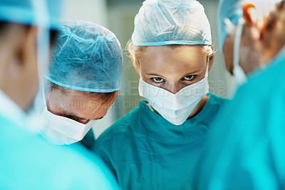 Buy stock photo Surgery, help and face mask with doctors in theater at hospital for medical operation, healing or accident. Procedure, healthcare and emergency rescue with portrait of person in operating room