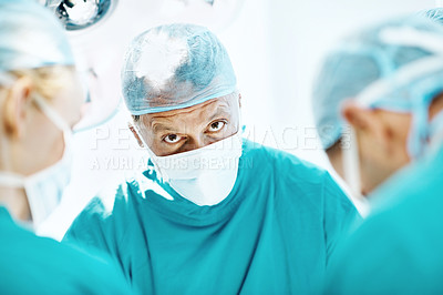 Buy stock photo Surgery, help and healthcare with doctors in theater at hospital for medical operation, healing or accident. Procedure, face mask and emergency rescue with portrait of person in operating room