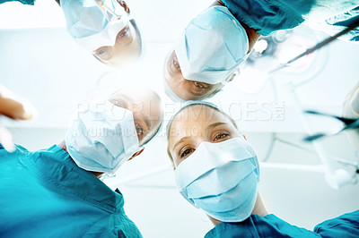 Buy stock photo Surgery, pov and portrait of doctors in theater at hospital for medical operation, healing or face mask. Procedure, healthcare and emergency rescue with low angle of people in operating room
