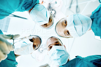 Buy stock photo Surgery, team and portrait of doctors in theater at hospital for medical operation, healing or face mask. Procedure pov, healthcare and emergency rescue with low angle of people in operating room