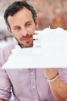 Buy stock photo Architecture, thinking and man in office with model, building design and structure for planning. Creative, business and mature person with 3d layout for blueprint, prototype or inspection for project