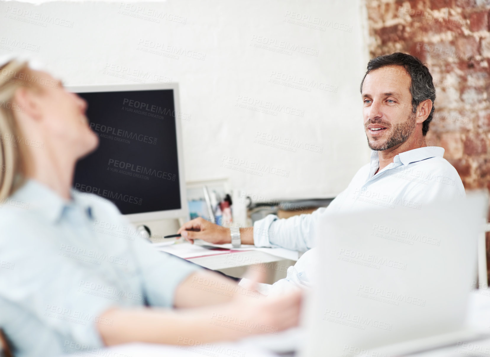 Buy stock photo Talking, tech and friends with business man in office for discussion, branding advisor and team. Campaign mentor, meeting and conversation with people in media agency for collaboration and research