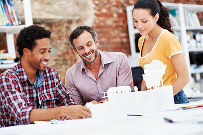 Buy stock photo Team, architects and planning with model in meeting, real estate design or building discussion. Smile, people or construction prototype in startup office, creative engineering or property development