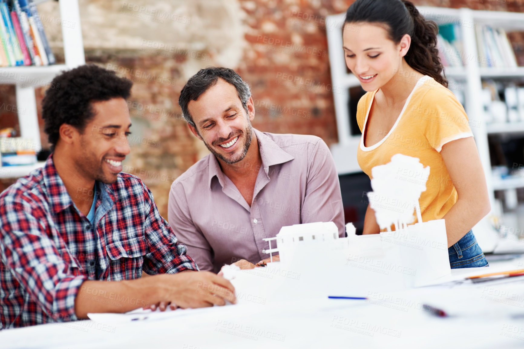 Buy stock photo Team, architects and planning with model in meeting, real estate design or building discussion. Smile, people or construction prototype in startup office, creative engineering or property development