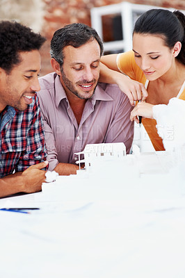 Buy stock photo Architect, team and talking with 3D model in office, brainstorming and real estate design in meeting. Architecture, designer and people with prototype, collaboration and property development ideas