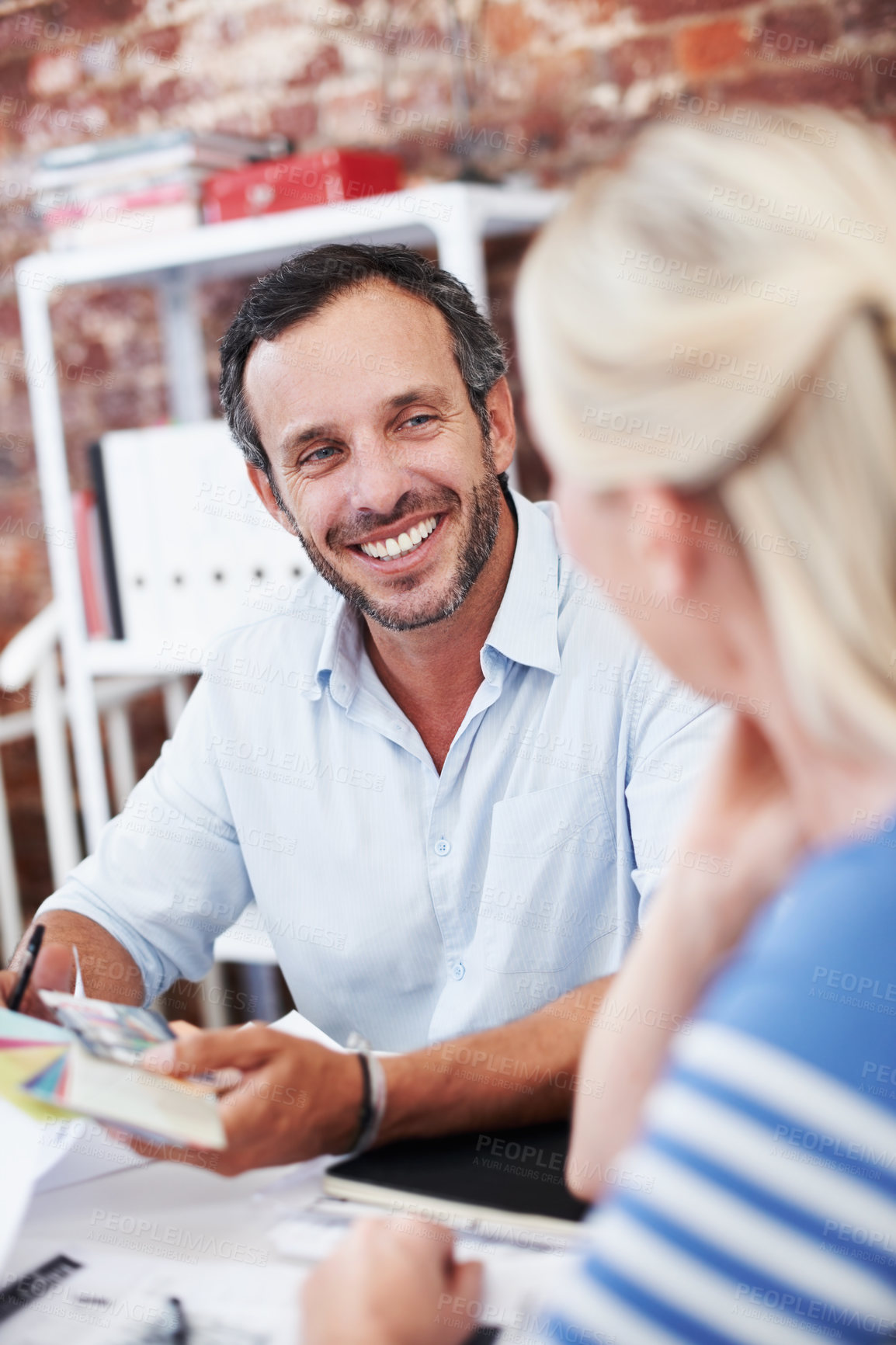 Buy stock photo Team, meeting and mentor with business man in office for interior design feedback, planning and smile. Architect swatch, manager briefing and project management with employees in agency for workshop