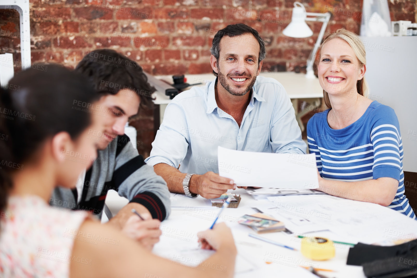 Buy stock photo Meeting, team and portrait with business people in office for interior design, planning and blueprint review. Decor, briefing, proposal feedback and brainstorming with employees in creative firm