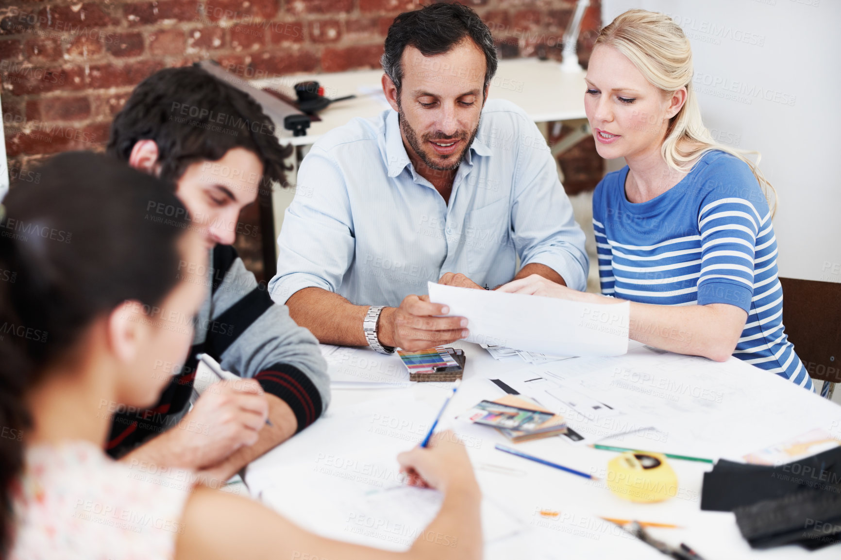 Buy stock photo Discussion, team and documents with business people in office for interior design, planning and blueprint review. Decor, briefing, project feedback and brainstorming with employees in creative firm