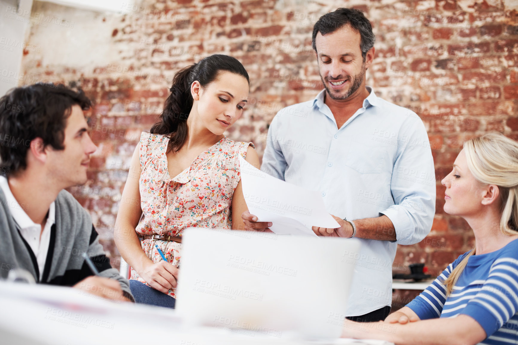 Buy stock photo Meeting, documents and team with business people in office for mentor, design briefing and brainstorming. Creative crit session, manager feedback and collaboration with employees in startup agency