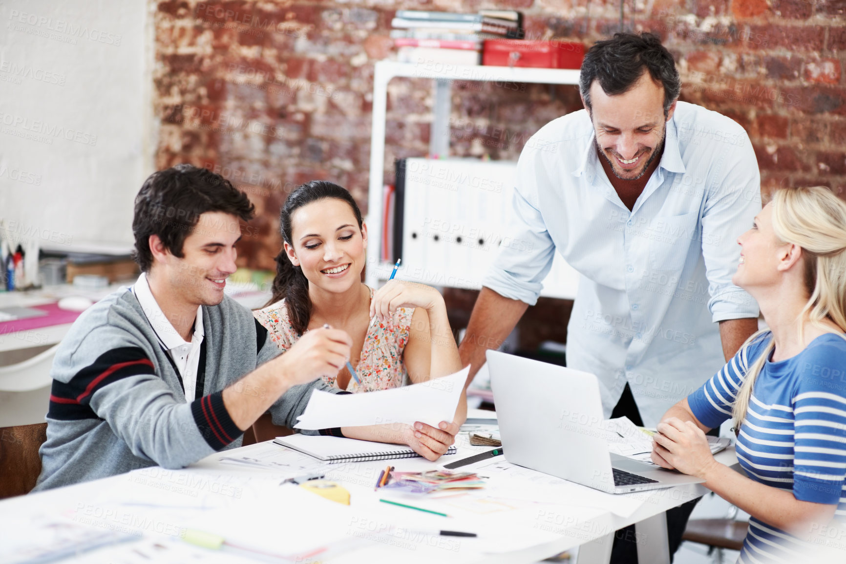 Buy stock photo Meeting, laptop and feedback with business people in office for mentor, design team or brainstorming. Creative crit session, manager review and documents with employees in startup agency for planning