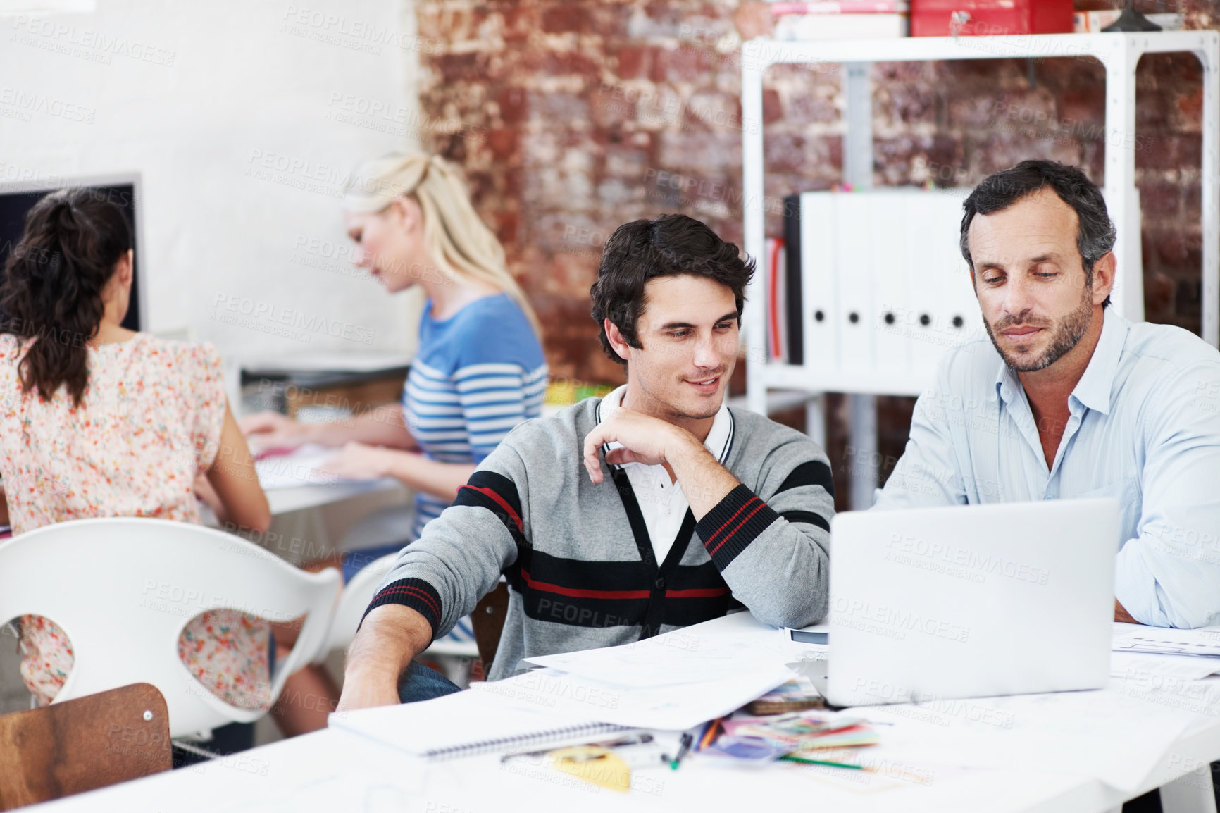 Buy stock photo Laptop, team and project with business people in office for interior design, planning and blueprint review. Decor, briefing, proposal feedback and brainstorming with employees in creative firm