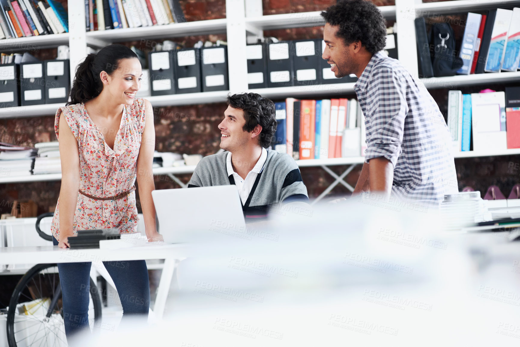 Buy stock photo People, team and discussion with laptop in office meeting for planning, explain or review at media company. Employee, group and tech with application, feedback and collaboration at creative agency