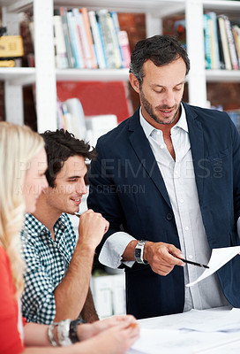 Buy stock photo Documents, mentor and team with business people in meeting for property development, planning and review. Blueprint proposal, architect crit session and collaboration with employees in agency