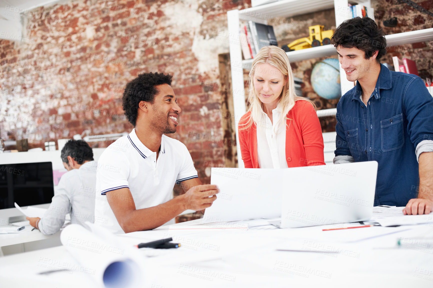 Buy stock photo Smile, people and architect in meeting with document, blueprint and planning for architecture. Team, talking and laptop in office with paperwork, floor plan and information for building development