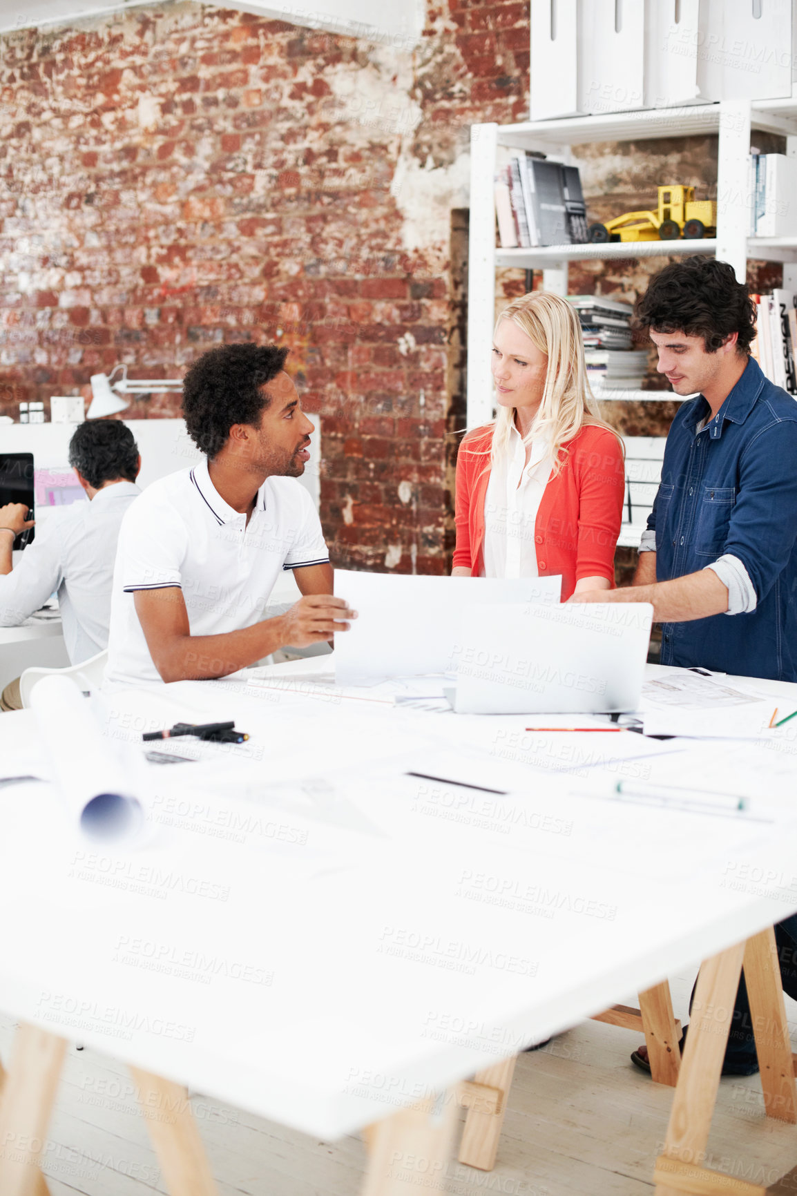 Buy stock photo Creative, people and architect in meeting with document, blueprint or planning for architecture. Team, talking and laptop in office with paperwork, floor plan and information for building development