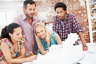 Buy stock photo Property development, meeting or people in office with model, collaboration or feedback in design review. Building, teamwork or architects with prototype, site plan or group evaluation of structure.