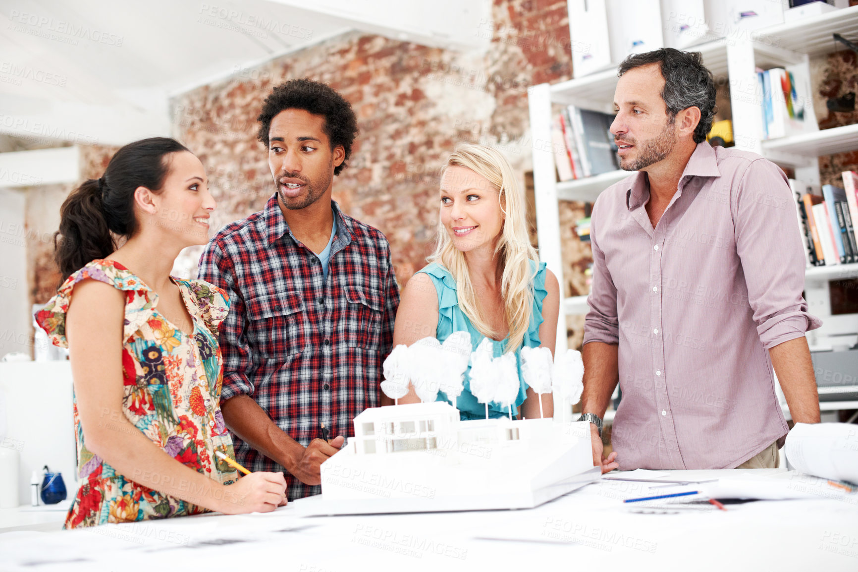 Buy stock photo Team, architects and planning with model in office, real estate design or building discussion. Smile, people and architecture prototype in meeting, creative engineering or property development
